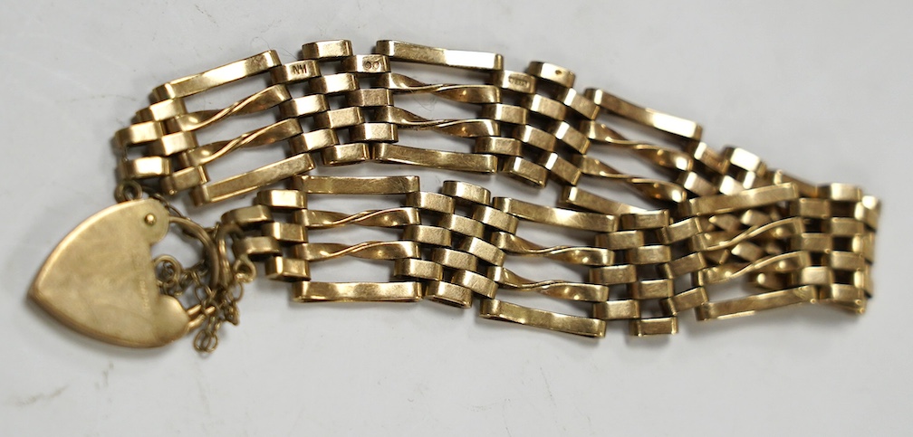 A 1970's 9ct gold gate link bracelet, with heart shaped padlock clasp, 16cm, 14.7 grams. Condition - poor to fair